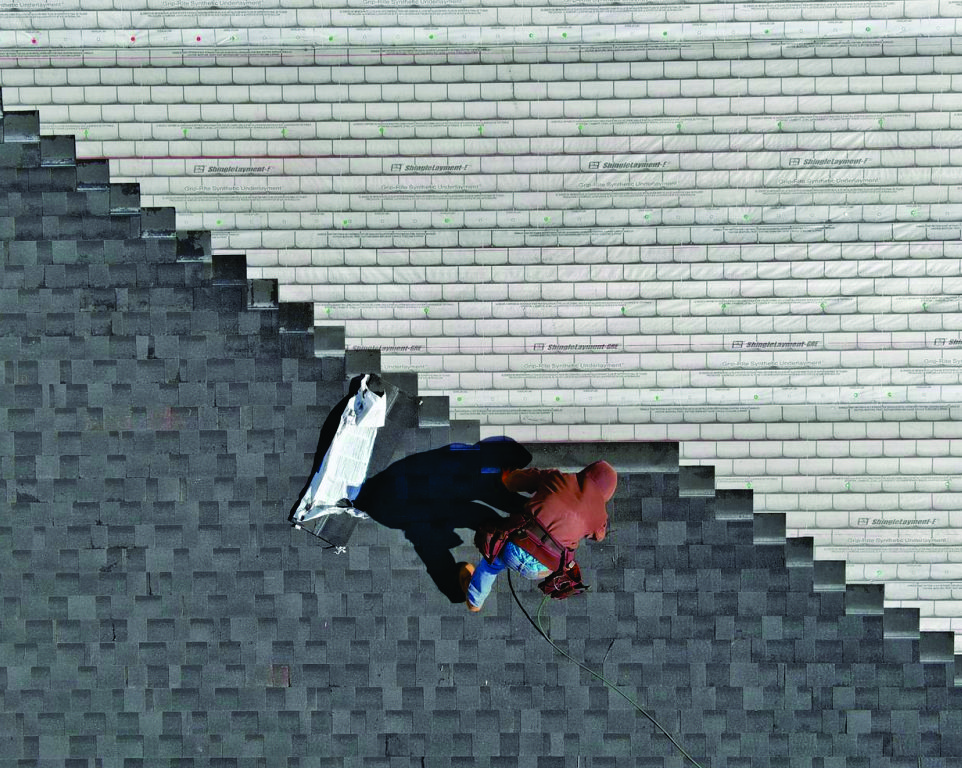 osprey roof working laying shingles residential roof